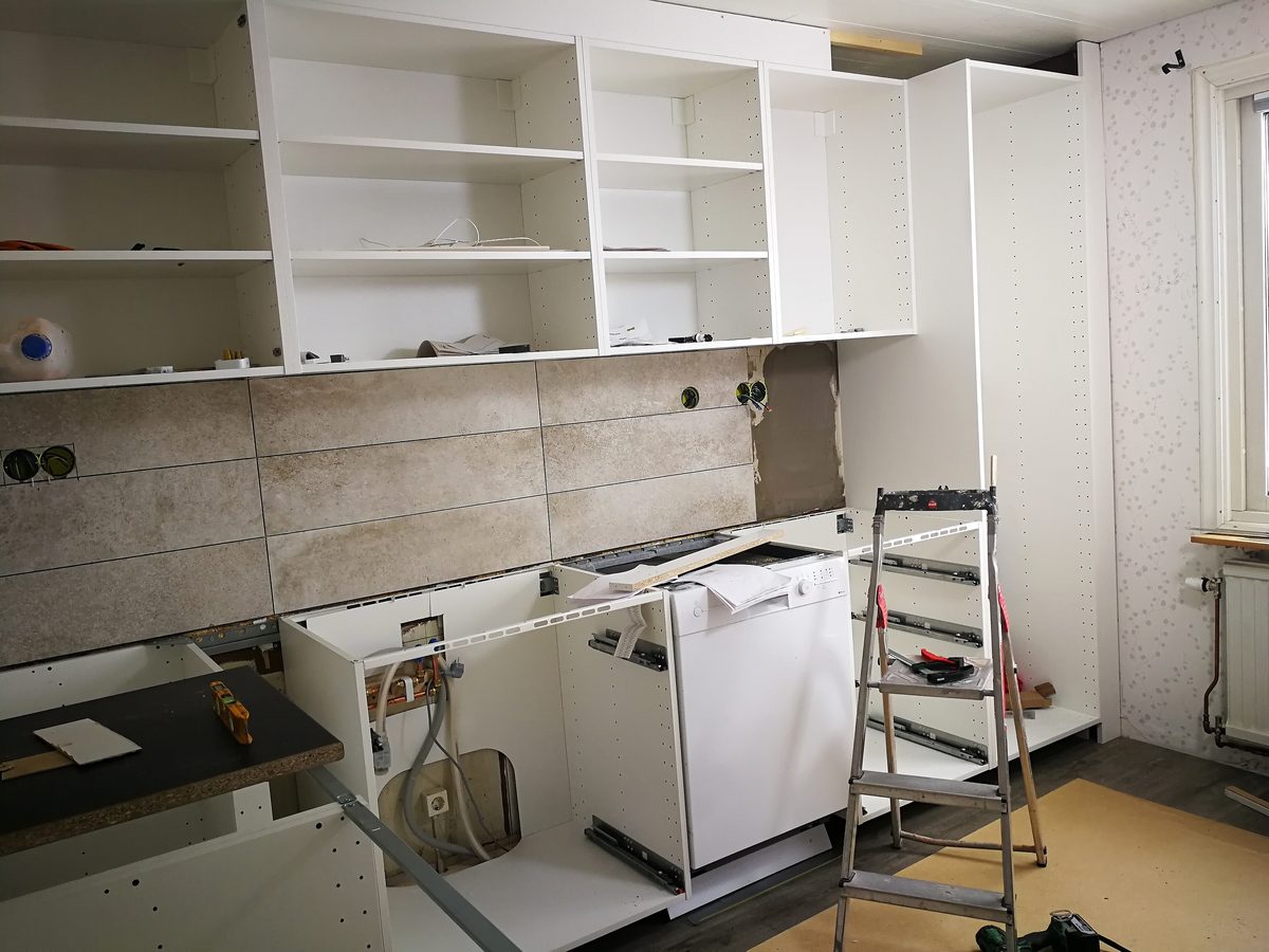 Cabinets being installed during a kitchen remodel