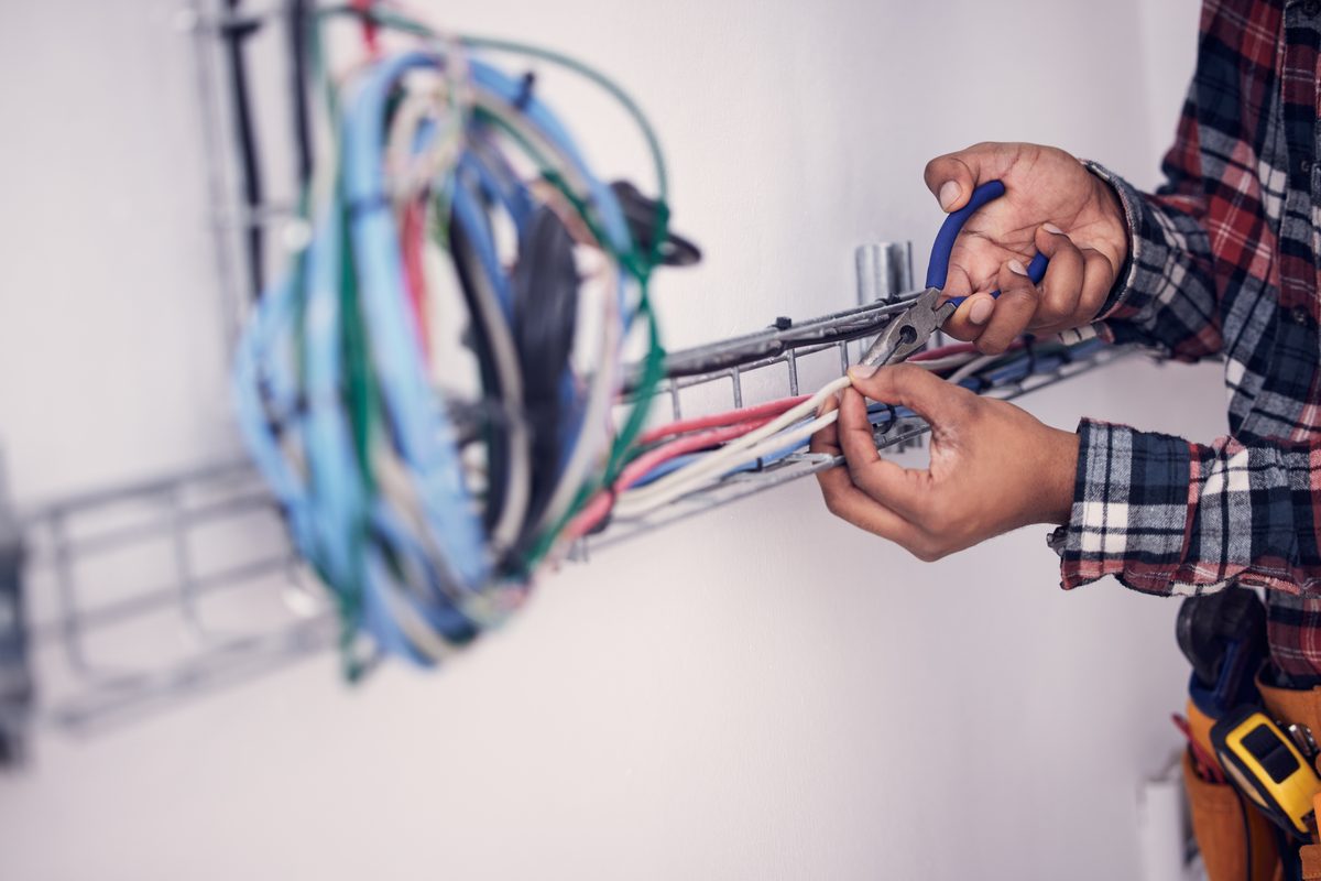 An electrician working on wiring