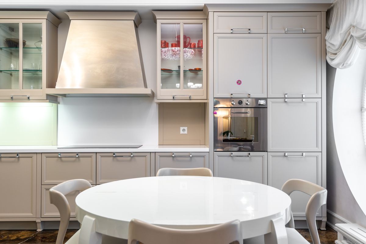 Cream traditional kitchen with a round dining table