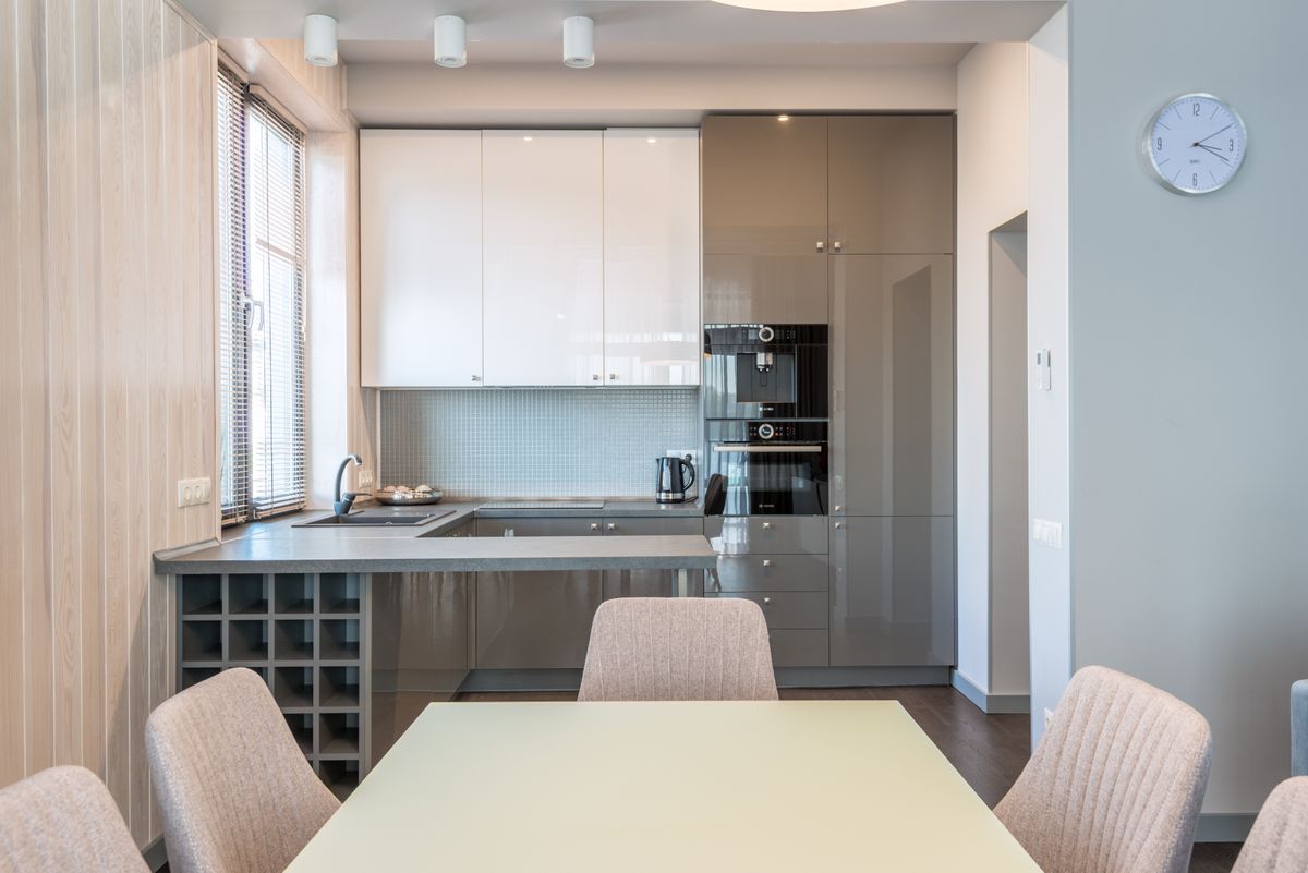 Compact kitchen with a stone worktop and dining table