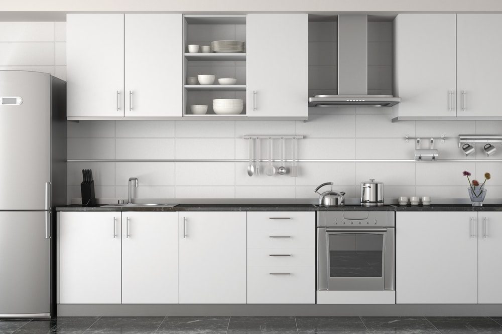 A run of wall and base cabinets with open shelving above the worktop